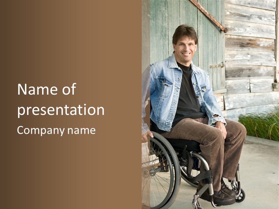 A Man In A Wheelchair Is Smiling For The Camera PowerPoint Template