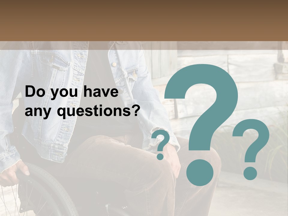 A Man In A Wheelchair Is Smiling For The Camera PowerPoint Template