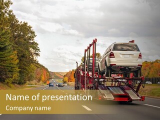 A Car Being Transported By A Truck On A Highway PowerPoint Template