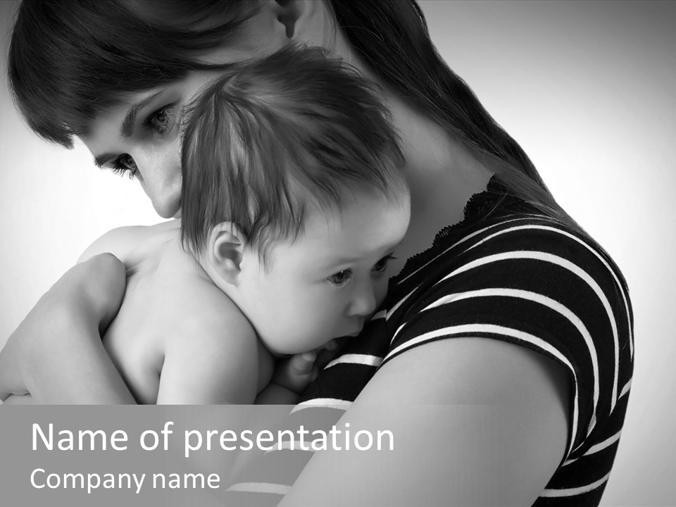 A Woman Holding A Baby In Her Arms PowerPoint Template