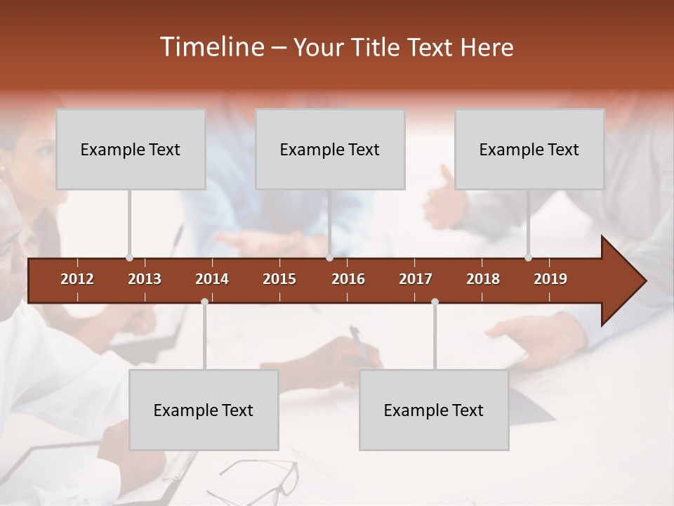 A Group Of People Sitting Around A Table PowerPoint Template