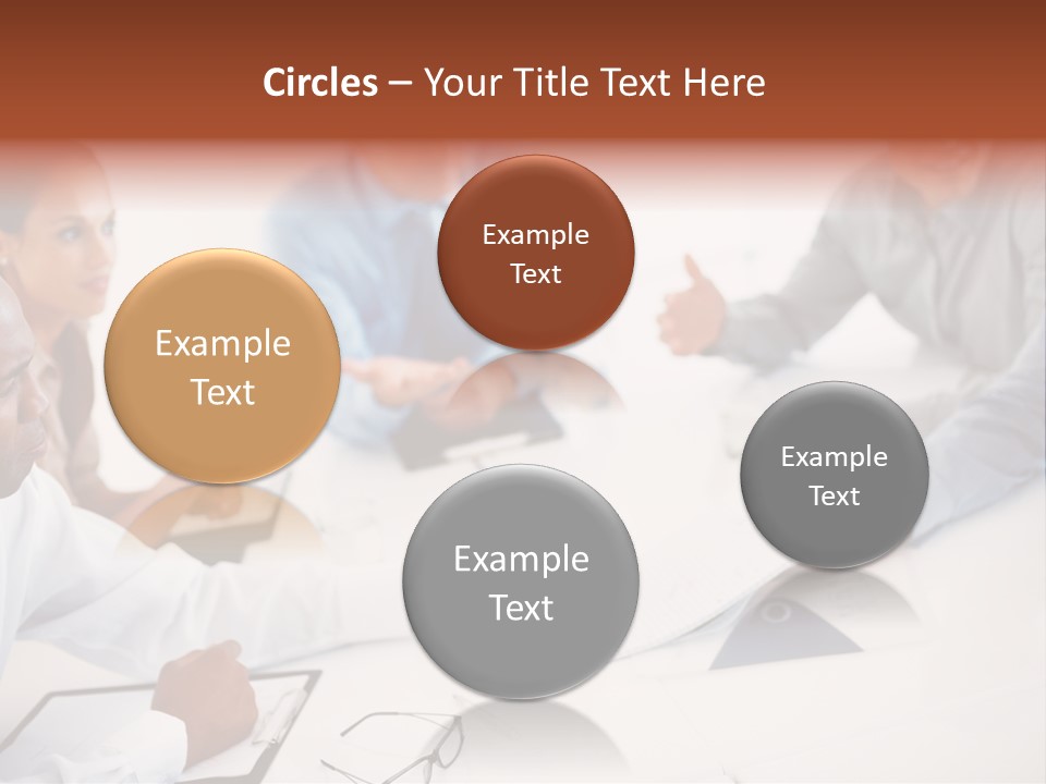 A Group Of People Sitting Around A Table PowerPoint Template