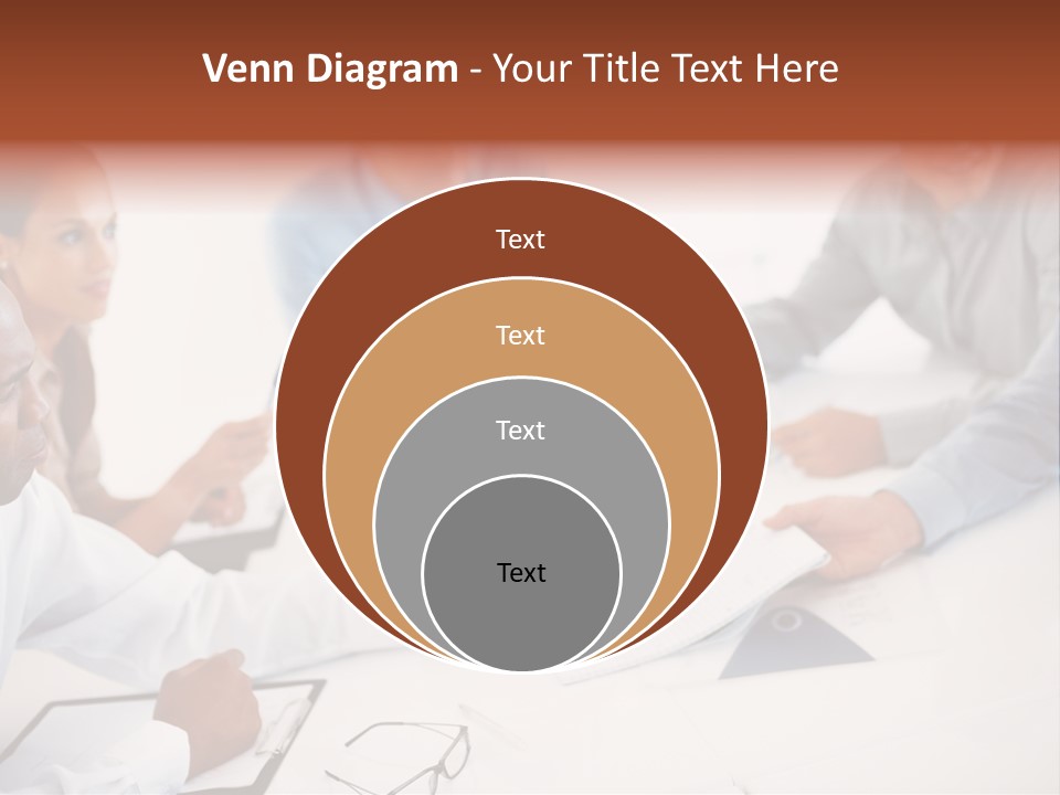 A Group Of People Sitting Around A Table PowerPoint Template