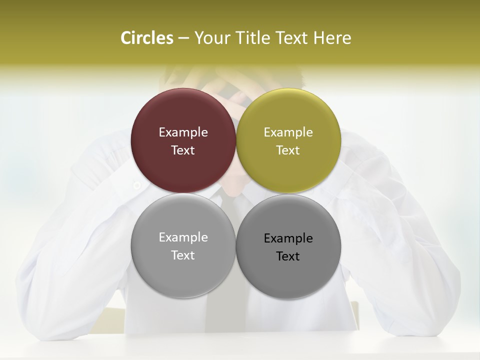 A Man Sitting At A Desk With His Hands On His Head PowerPoint Template