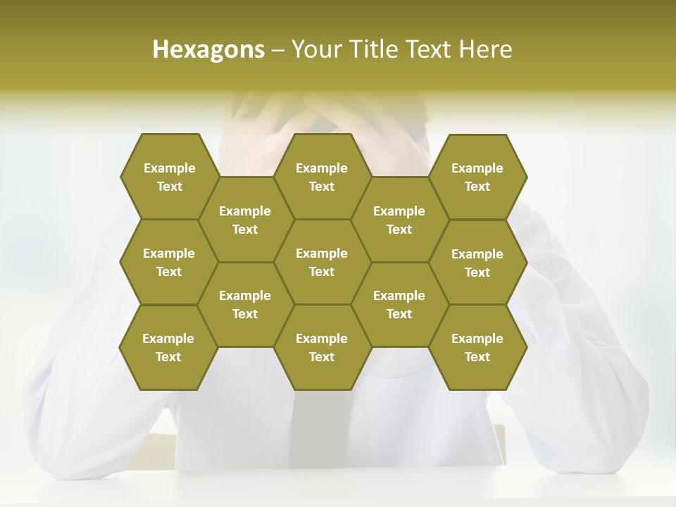 A Man Sitting At A Desk With His Hands On His Head PowerPoint Template