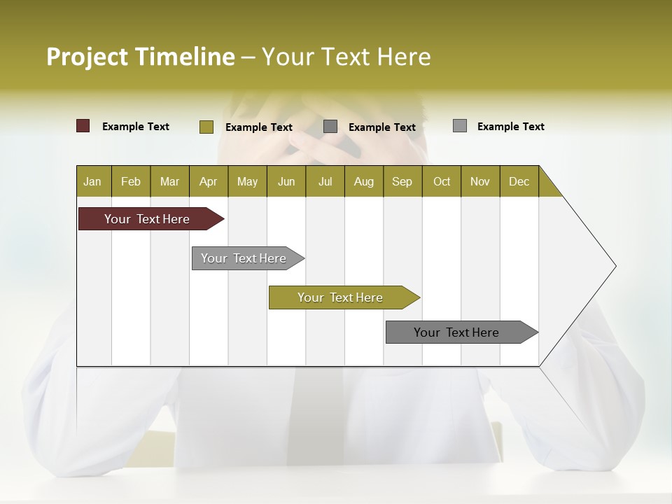 A Man Sitting At A Desk With His Hands On His Head PowerPoint Template