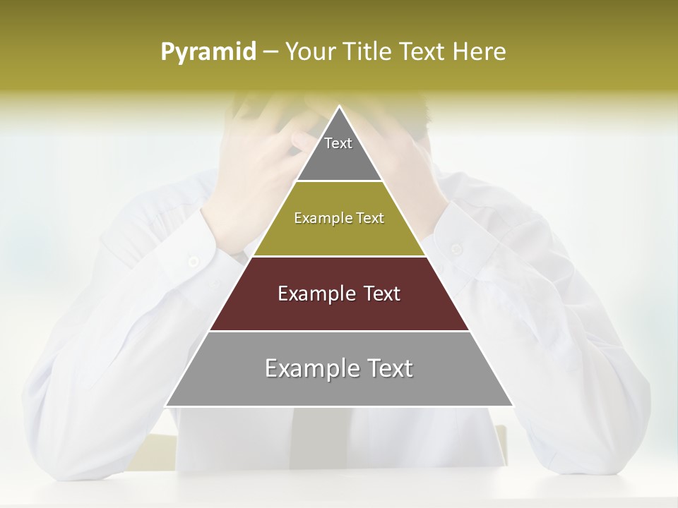 A Man Sitting At A Desk With His Hands On His Head PowerPoint Template