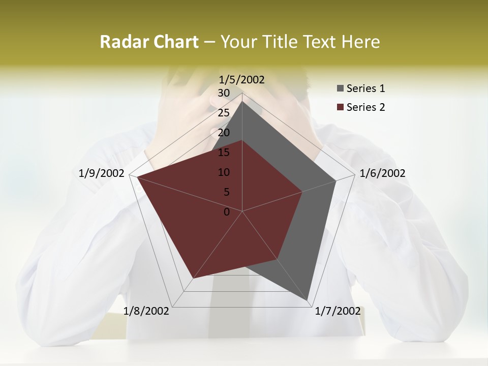 A Man Sitting At A Desk With His Hands On His Head PowerPoint Template