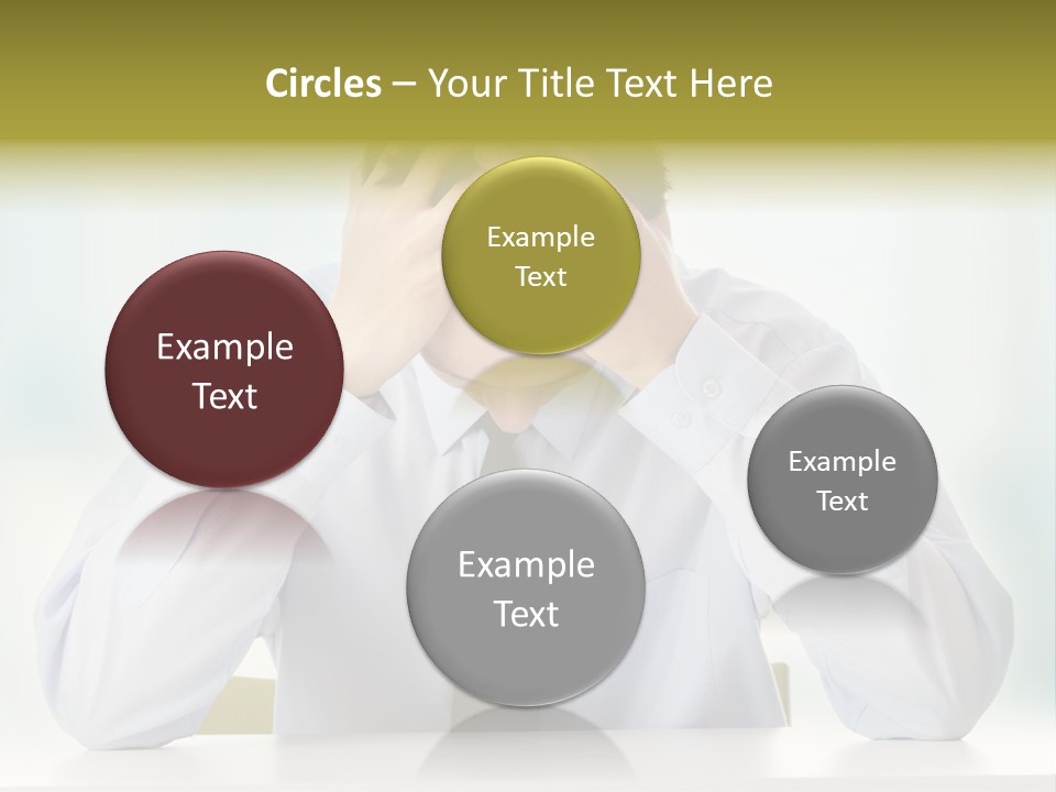 A Man Sitting At A Desk With His Hands On His Head PowerPoint Template