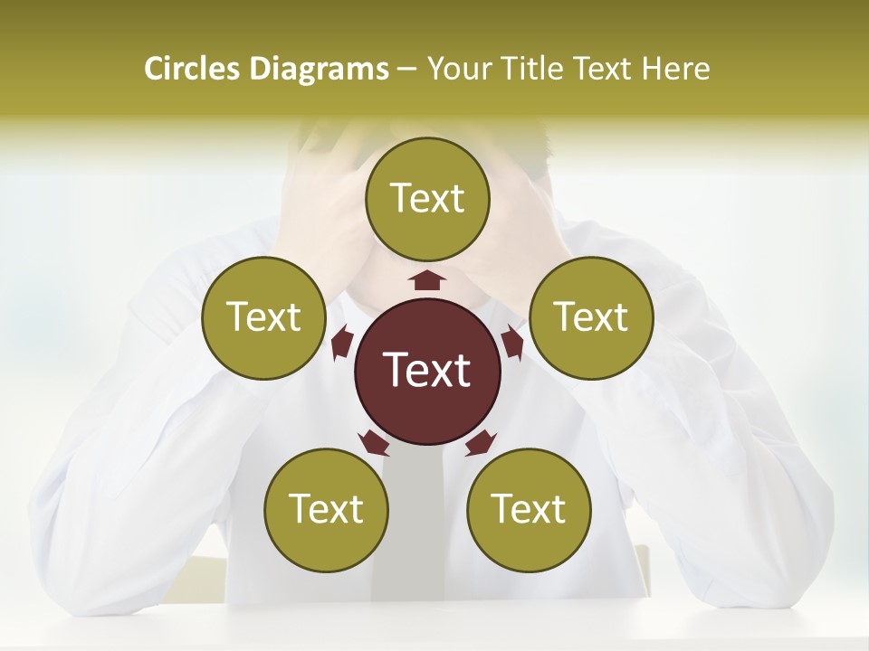 A Man Sitting At A Desk With His Hands On His Head PowerPoint Template