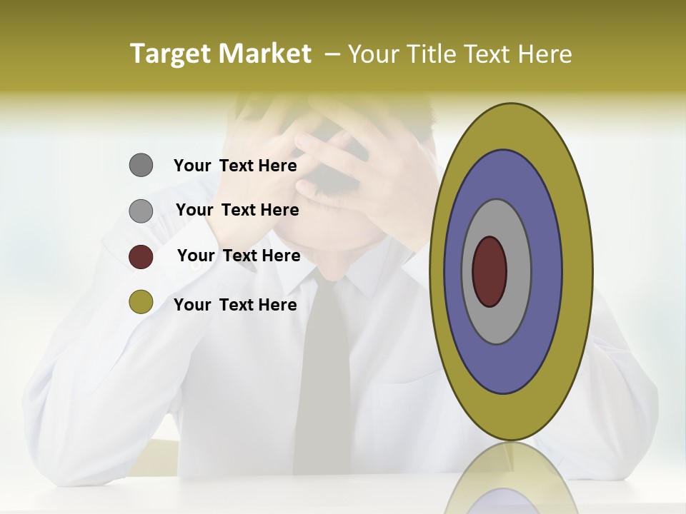 A Man Sitting At A Desk With His Hands On His Head PowerPoint Template