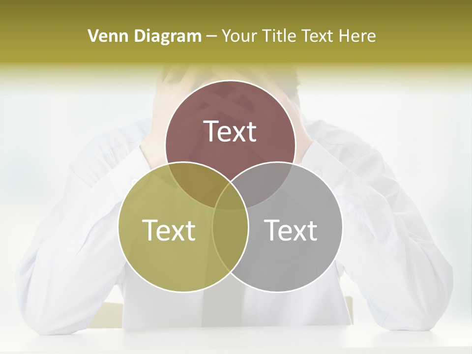 A Man Sitting At A Desk With His Hands On His Head PowerPoint Template