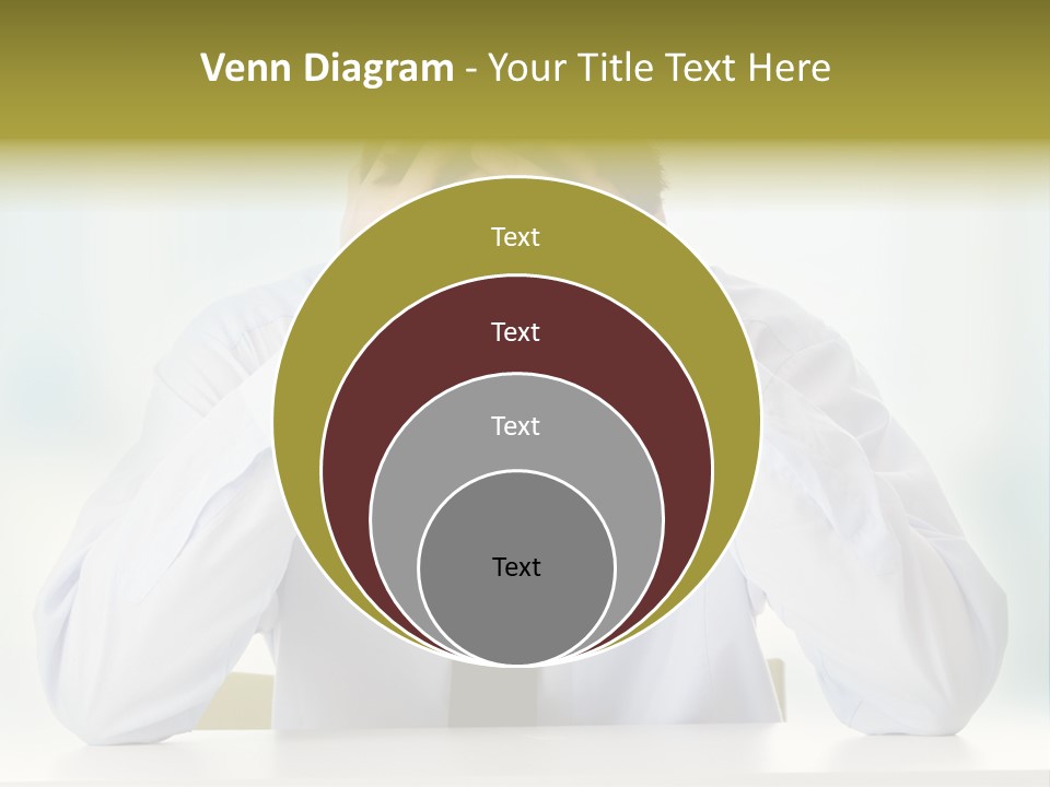 A Man Sitting At A Desk With His Hands On His Head PowerPoint Template