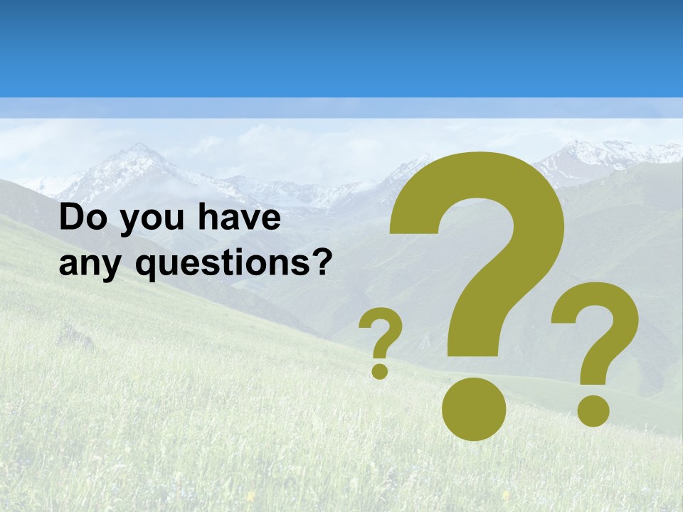 A Green Field With Mountains In The Background PowerPoint Template