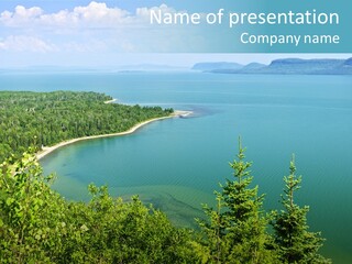 A Large Body Of Water Surrounded By Trees PowerPoint Template