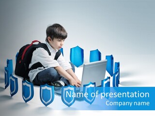 A Young Boy Sitting On The Ground Using A Laptop PowerPoint Template