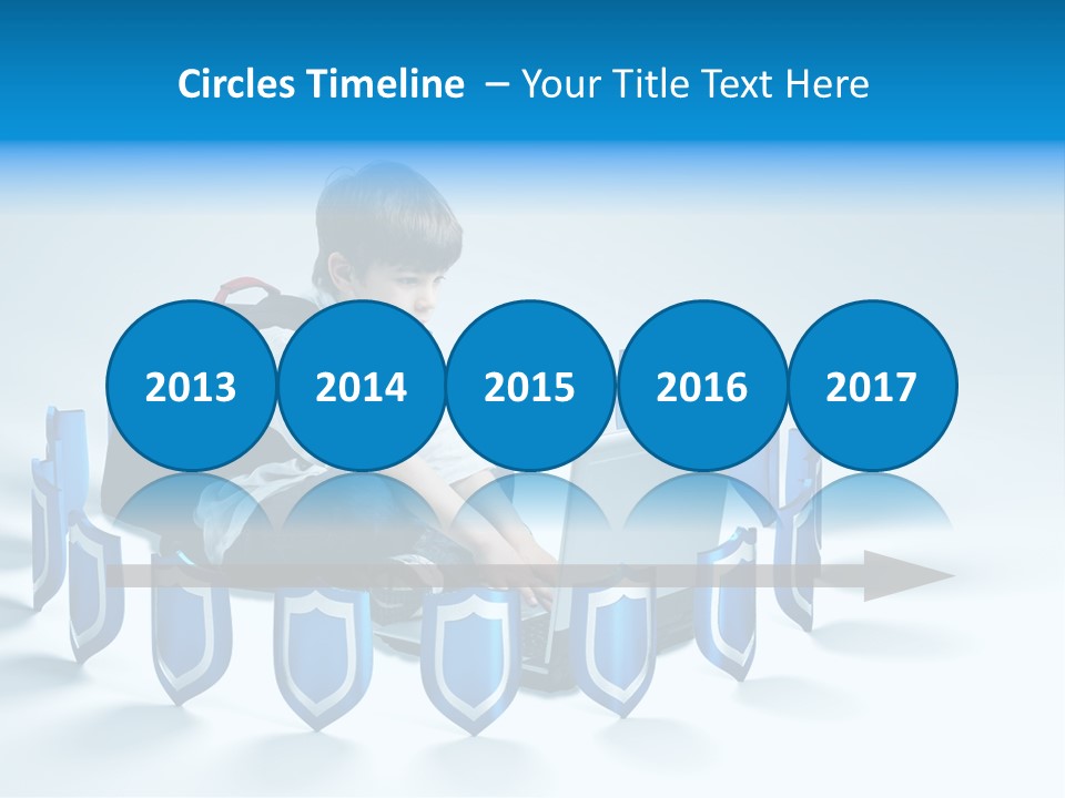 A Young Boy Sitting On The Ground Using A Laptop PowerPoint Template