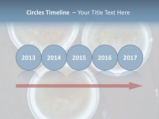 Three Cups Of Coffee Sitting On Top Of A Wooden Table PowerPoint Template