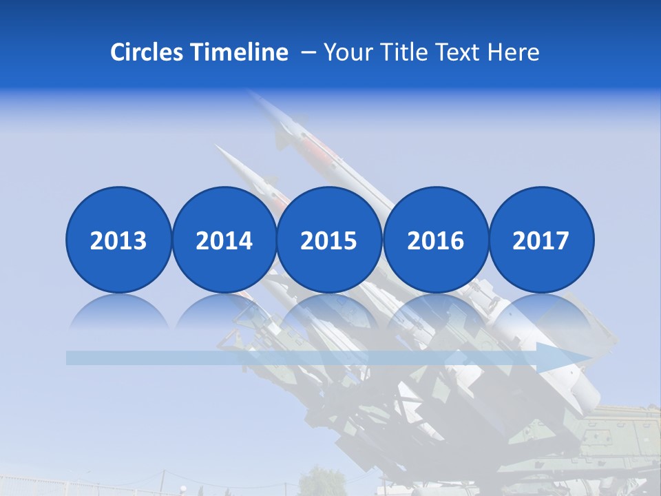 A Group Of Missiles On Display In Front Of A Blue Sky PowerPoint Template