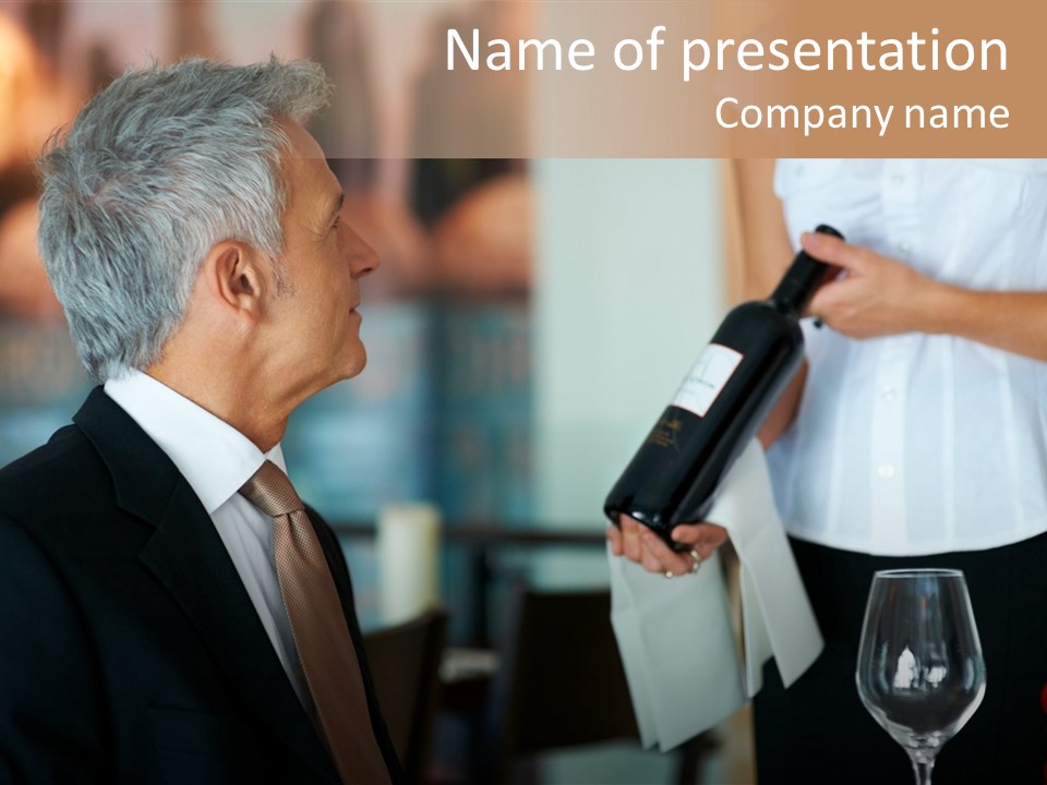 A Man In A Suit Holding A Bottle Of Wine PowerPoint Template