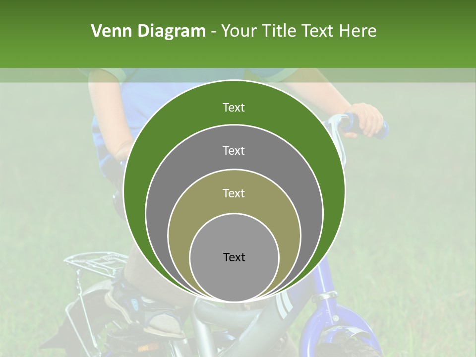 A Young Boy Is Riding A Bike In The Grass PowerPoint Template