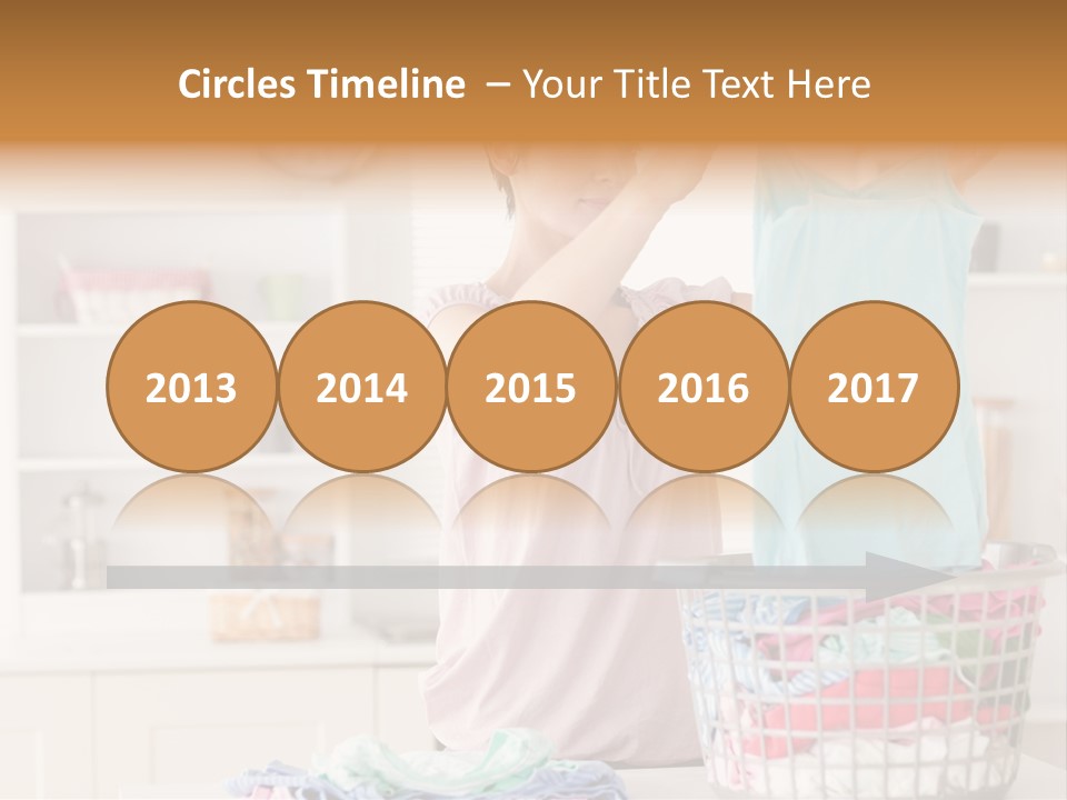 A Woman Holding A Blue Shirt In Front Of A Laundry Basket PowerPoint Template