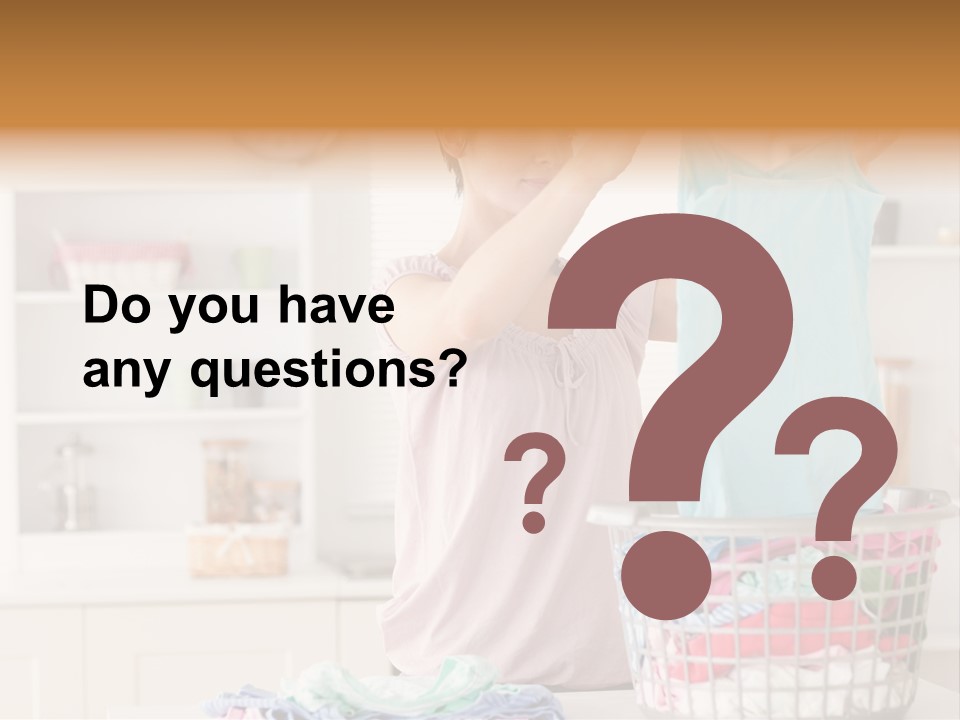 A Woman Holding A Blue Shirt In Front Of A Laundry Basket PowerPoint Template