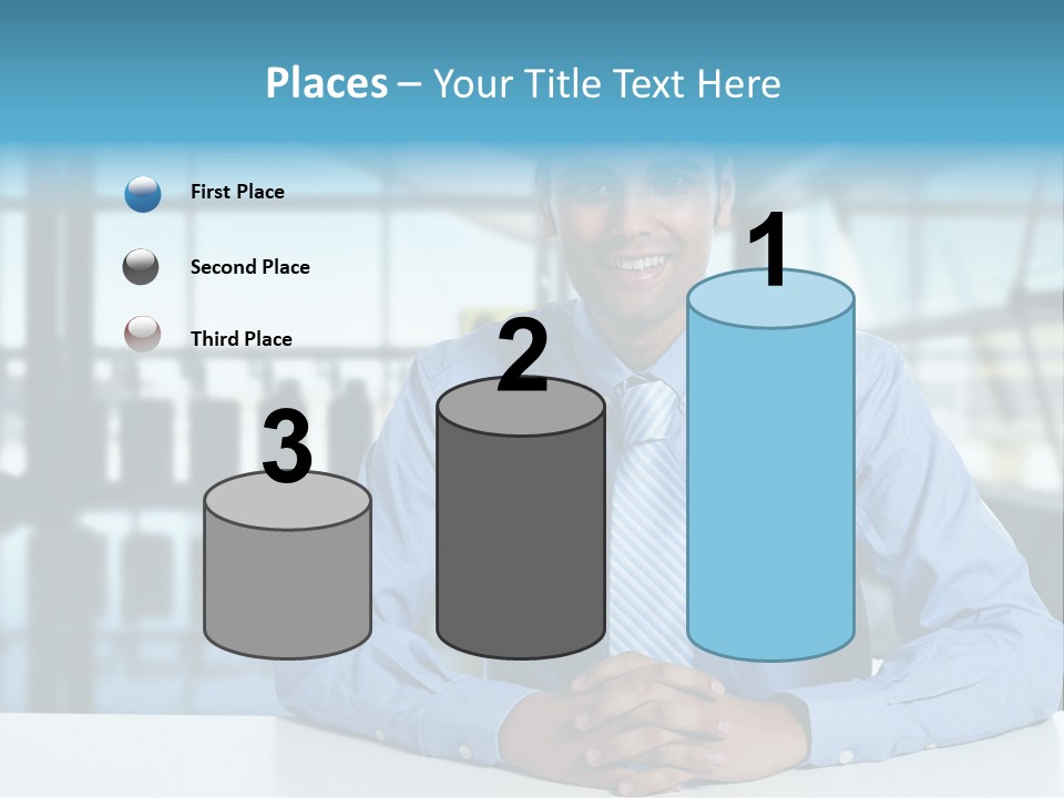 A Man In A Blue Shirt And Tie Sitting At A Table PowerPoint Template