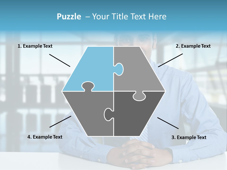 A Man In A Blue Shirt And Tie Sitting At A Table PowerPoint Template