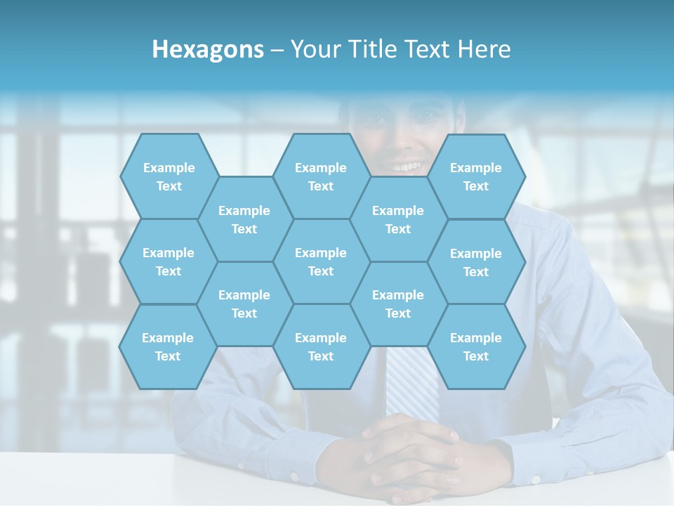 A Man In A Blue Shirt And Tie Sitting At A Table PowerPoint Template