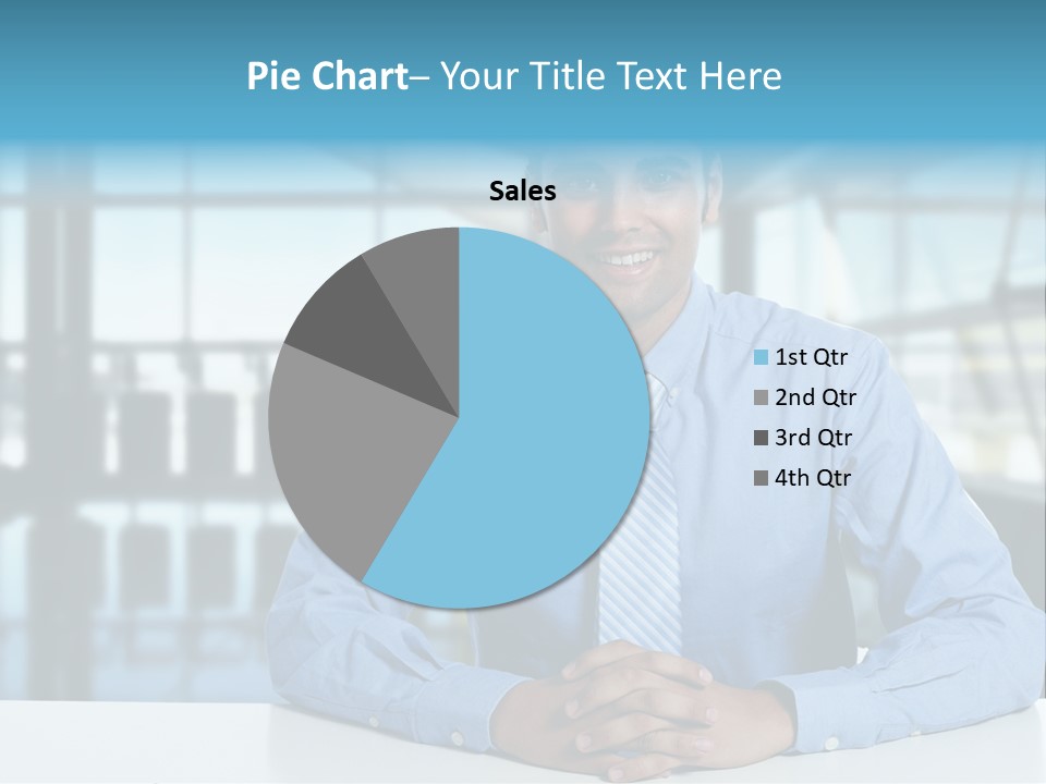 A Man In A Blue Shirt And Tie Sitting At A Table PowerPoint Template
