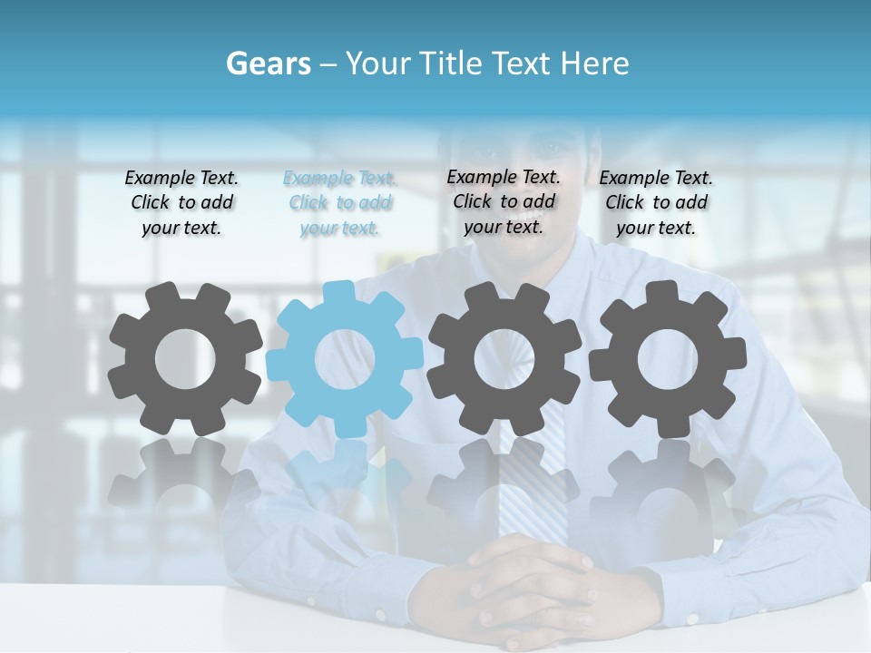 A Man In A Blue Shirt And Tie Sitting At A Table PowerPoint Template