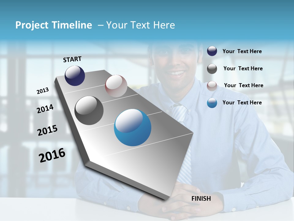 A Man In A Blue Shirt And Tie Sitting At A Table PowerPoint Template