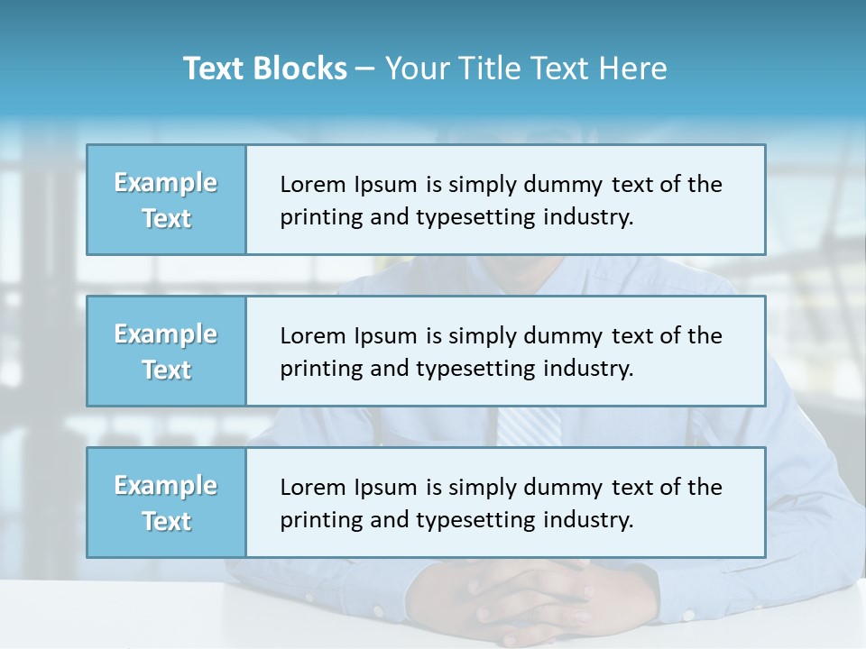 A Man In A Blue Shirt And Tie Sitting At A Table PowerPoint Template