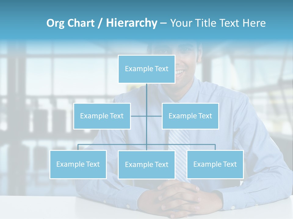 A Man In A Blue Shirt And Tie Sitting At A Table PowerPoint Template