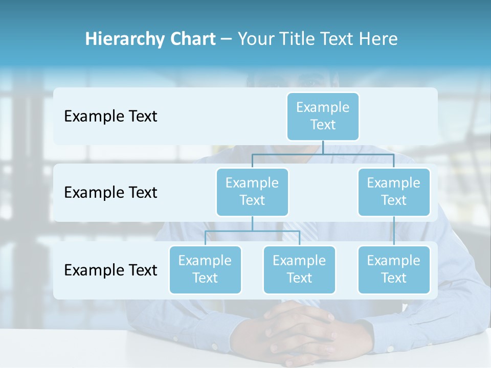 A Man In A Blue Shirt And Tie Sitting At A Table PowerPoint Template