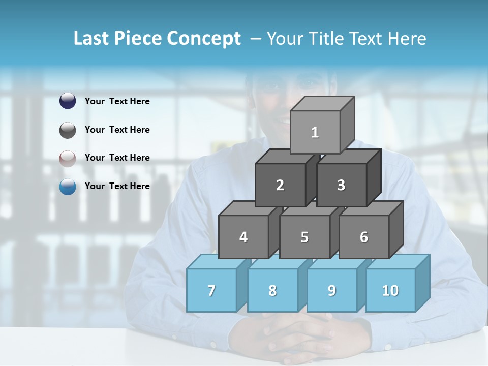 A Man In A Blue Shirt And Tie Sitting At A Table PowerPoint Template