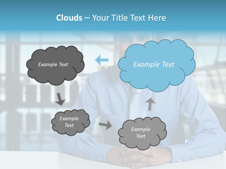A Man In A Blue Shirt And Tie Sitting At A Table PowerPoint Template