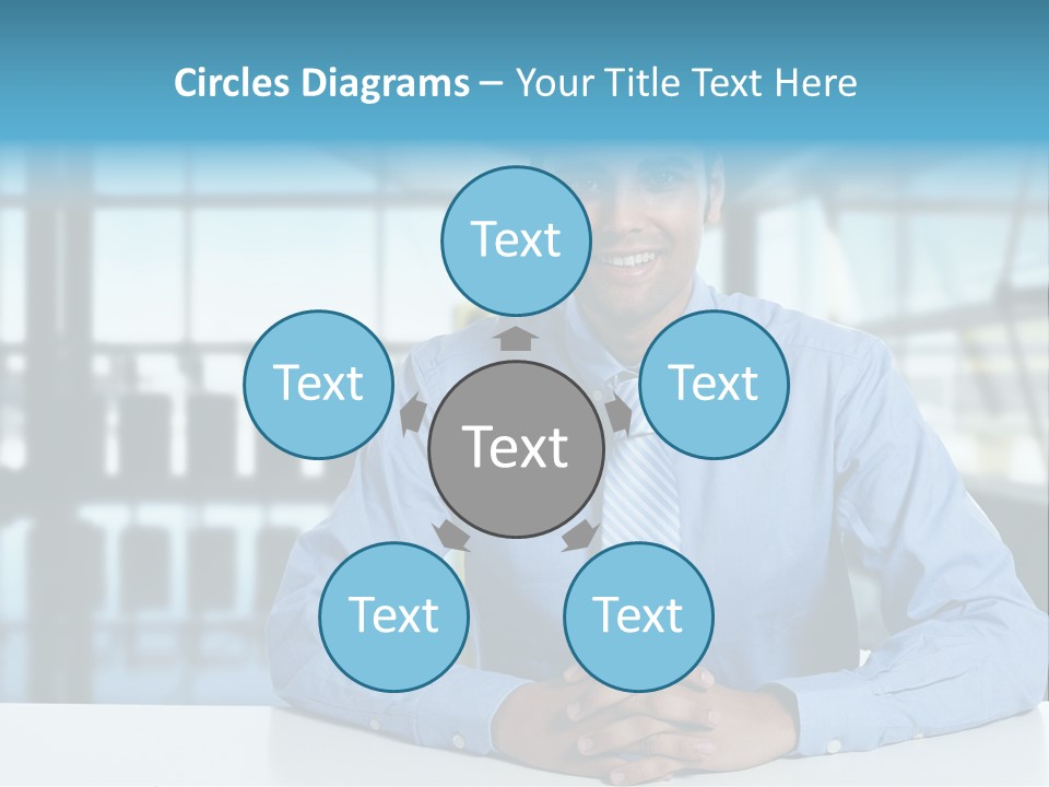 A Man In A Blue Shirt And Tie Sitting At A Table PowerPoint Template