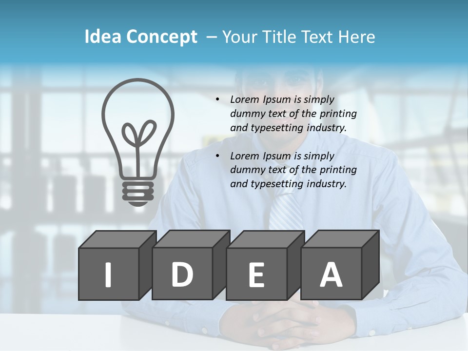 A Man In A Blue Shirt And Tie Sitting At A Table PowerPoint Template