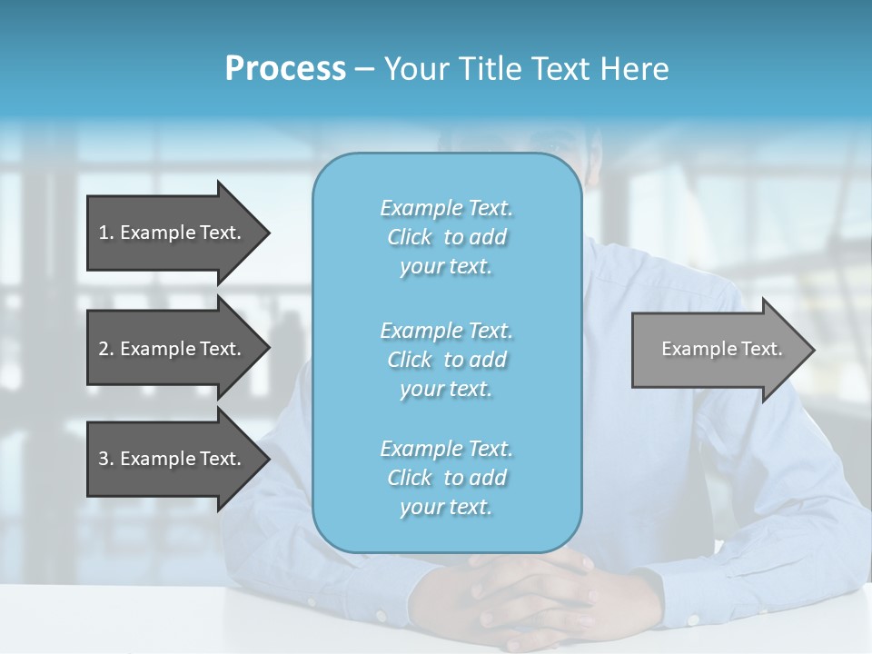 A Man In A Blue Shirt And Tie Sitting At A Table PowerPoint Template