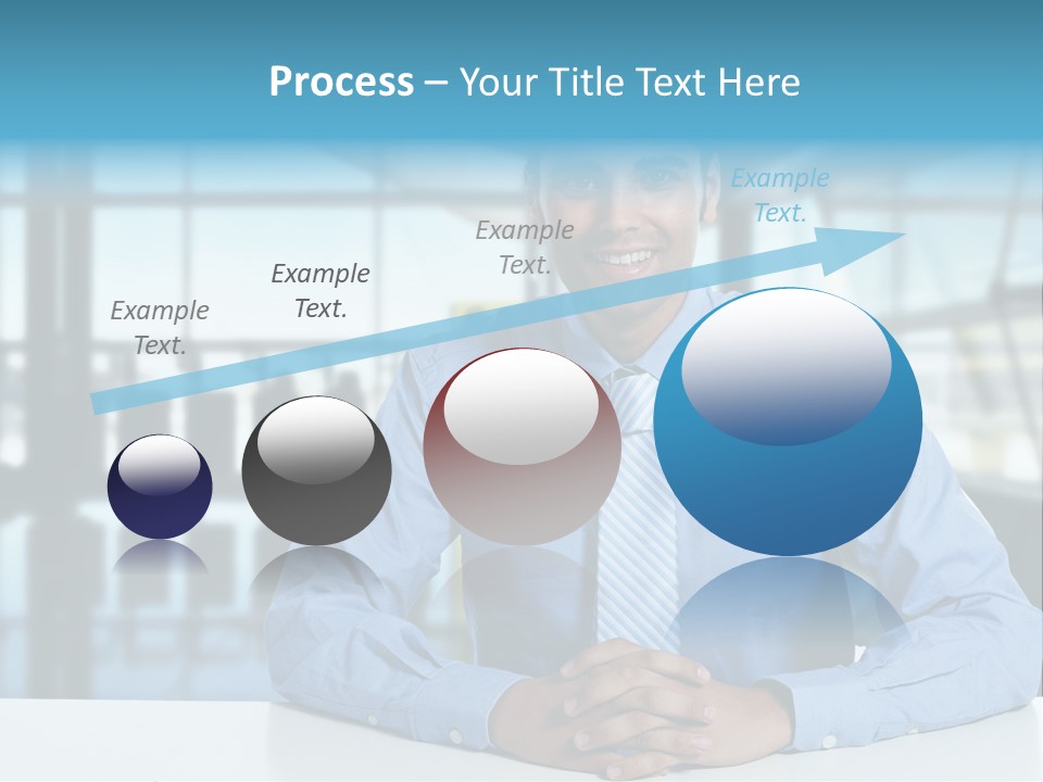 A Man In A Blue Shirt And Tie Sitting At A Table PowerPoint Template