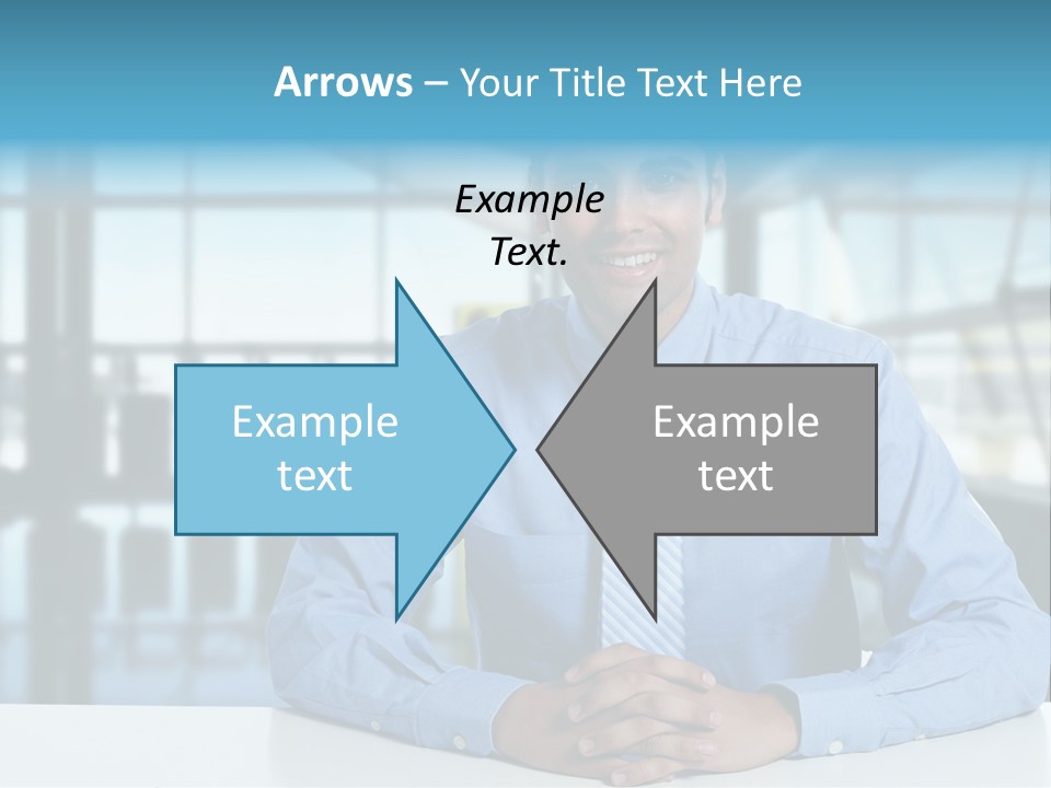 A Man In A Blue Shirt And Tie Sitting At A Table PowerPoint Template