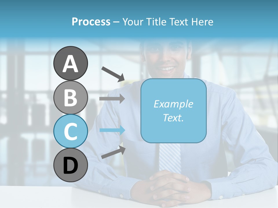 A Man In A Blue Shirt And Tie Sitting At A Table PowerPoint Template