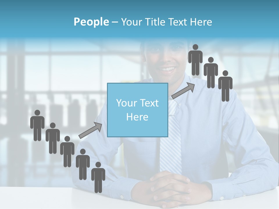 A Man In A Blue Shirt And Tie Sitting At A Table PowerPoint Template