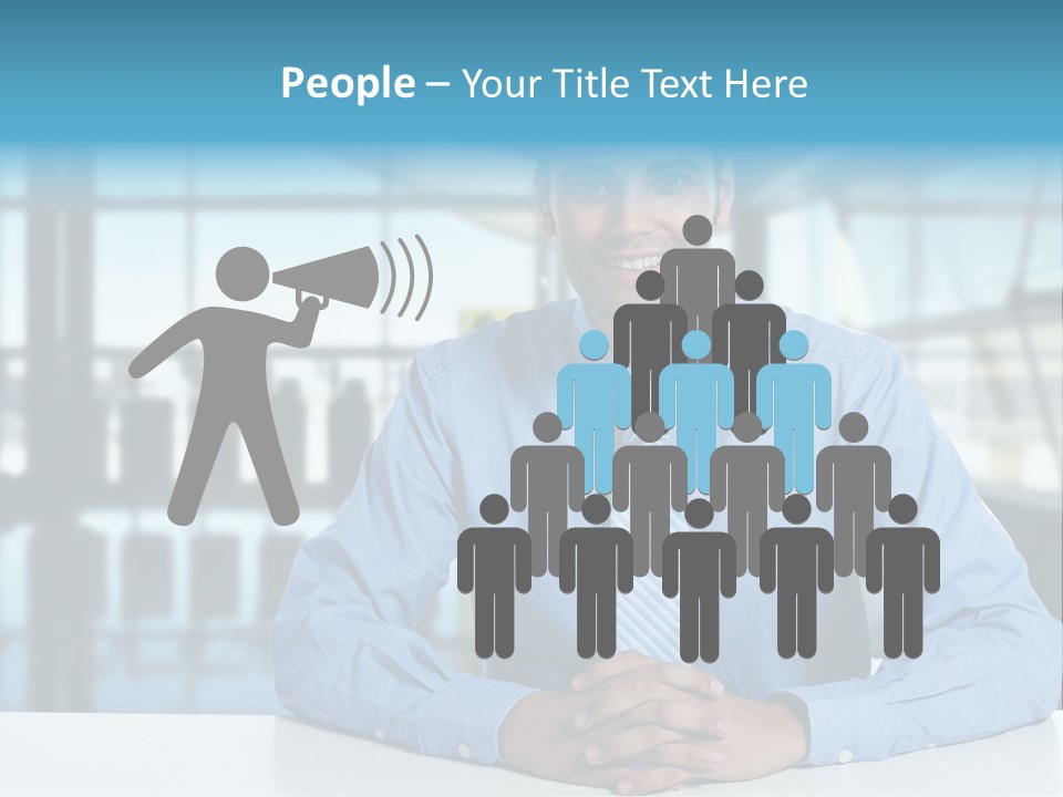 A Man In A Blue Shirt And Tie Sitting At A Table PowerPoint Template