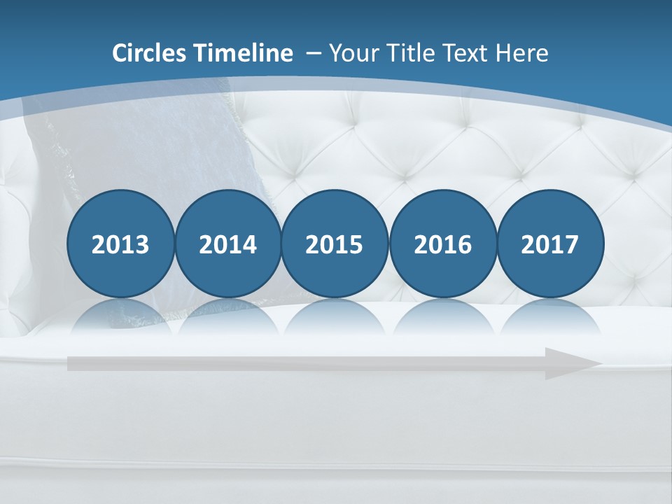 A White Couch With A Blue Pillow On It PowerPoint Template