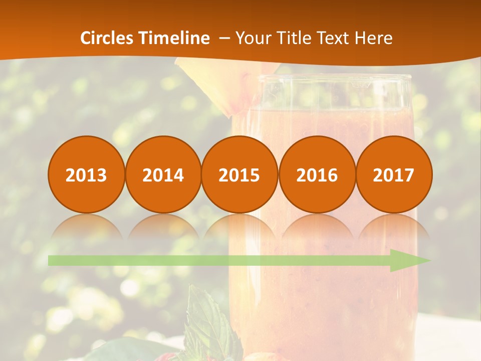 A Glass Of Orange Juice With Raspberries On A Table PowerPoint Template