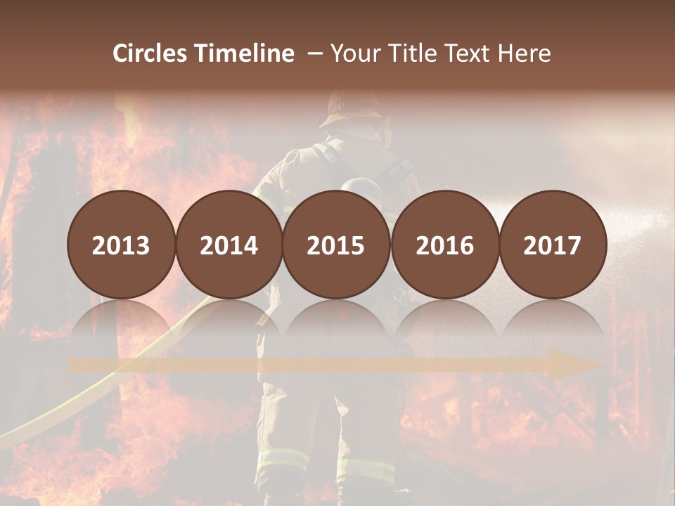 A Firefighter Spraying Water On A Fire PowerPoint Template