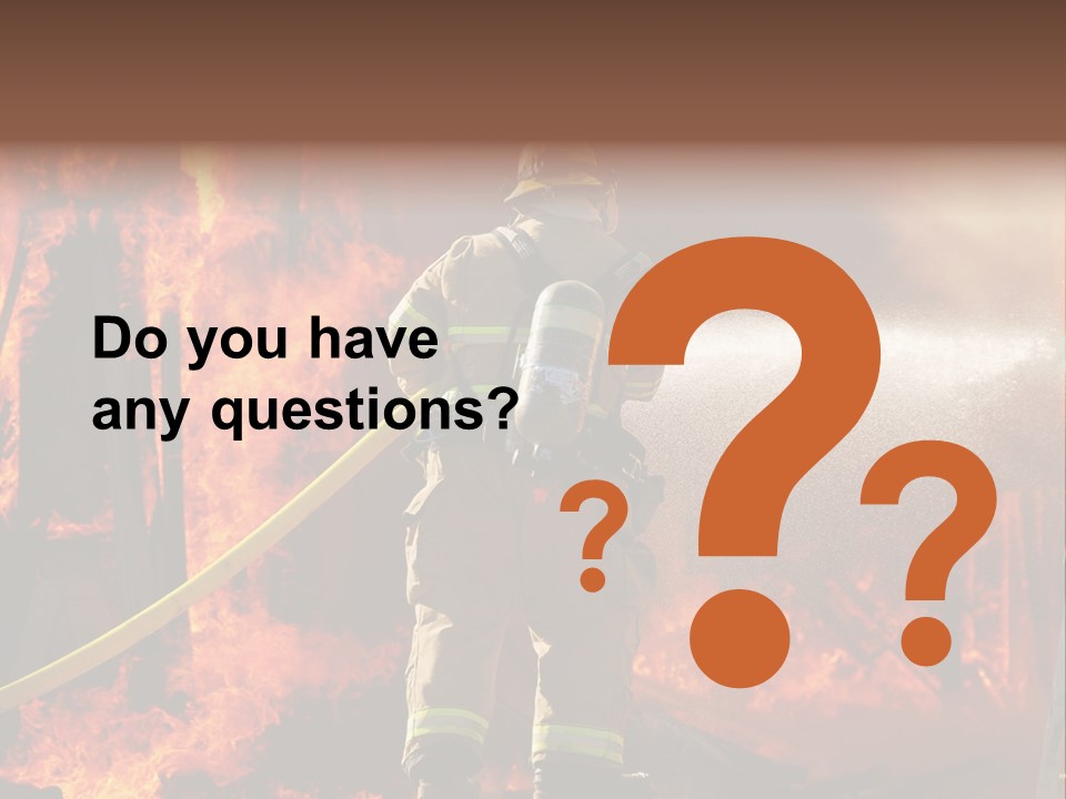 A Firefighter Spraying Water On A Fire PowerPoint Template